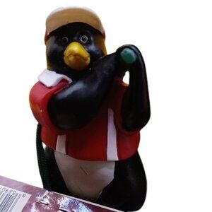 Trim a traditional golfing penguin christmas ornament